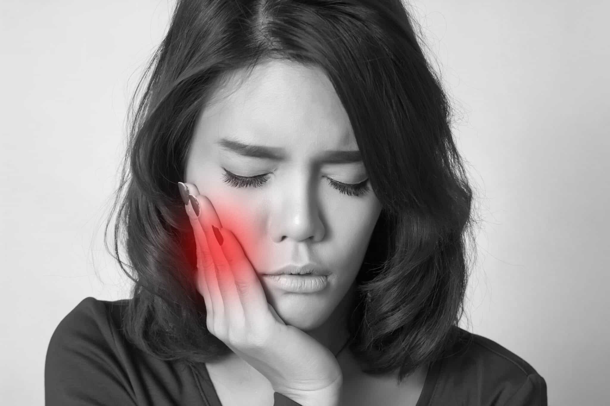 lady holding hand to cheek with toothache What To Do If You Have A Toothache Brite Smiles Dentistry dentist in Flower Mound, Tx Dr. Deepika Salguti DMD